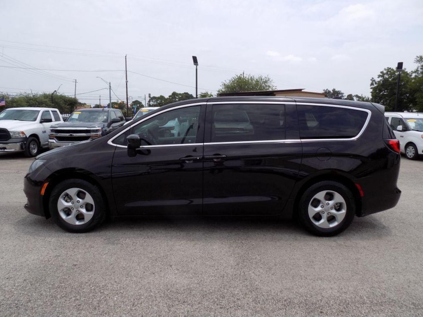 2017 BLACK CHRYSLER PACIFICA LX (2C4RC1CG1HR) with an 3.6L engine, Automatic transmission, located at 830 E. Canino Rd., Houston, TX, 77037, (281) 405-0440, 38.358219, -81.729942 - Photo#2