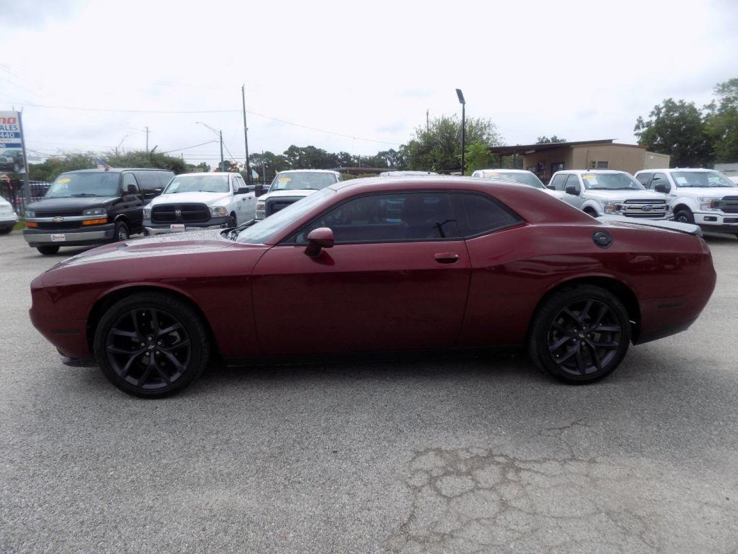 2021 MAROON DODGE CHALLENGER SXT (2C3CDZAG0MH) with an 3.6L engine, Automatic transmission, located at 830 E. Canino Rd., Houston, TX, 77037, (281) 405-0440, 38.358219, -81.729942 - Photo#1