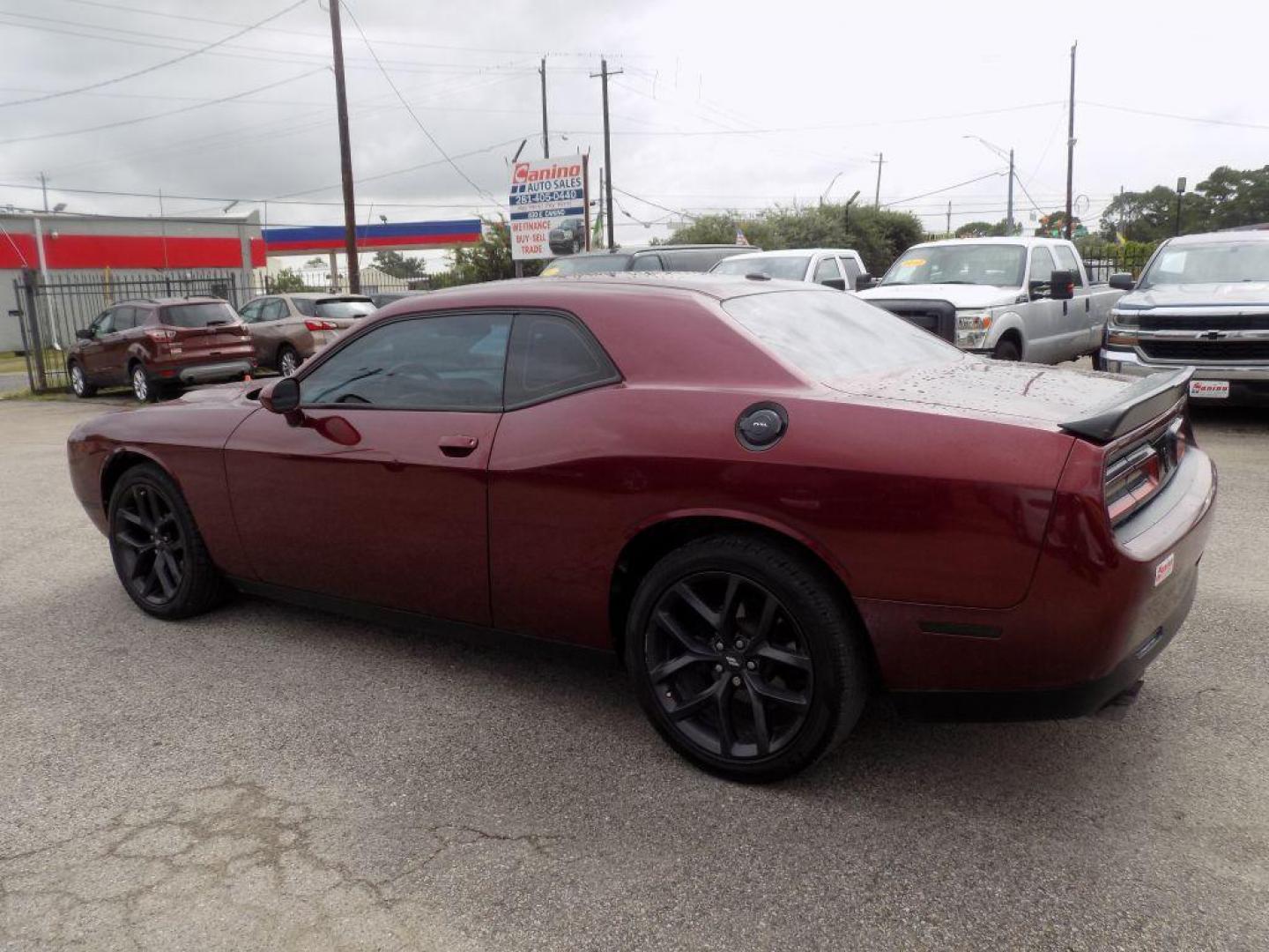 2021 MAROON DODGE CHALLENGER SXT (2C3CDZAG0MH) with an 3.6L engine, Automatic transmission, located at 830 E. Canino Rd., Houston, TX, 77037, (281) 405-0440, 38.358219, -81.729942 - Photo#2