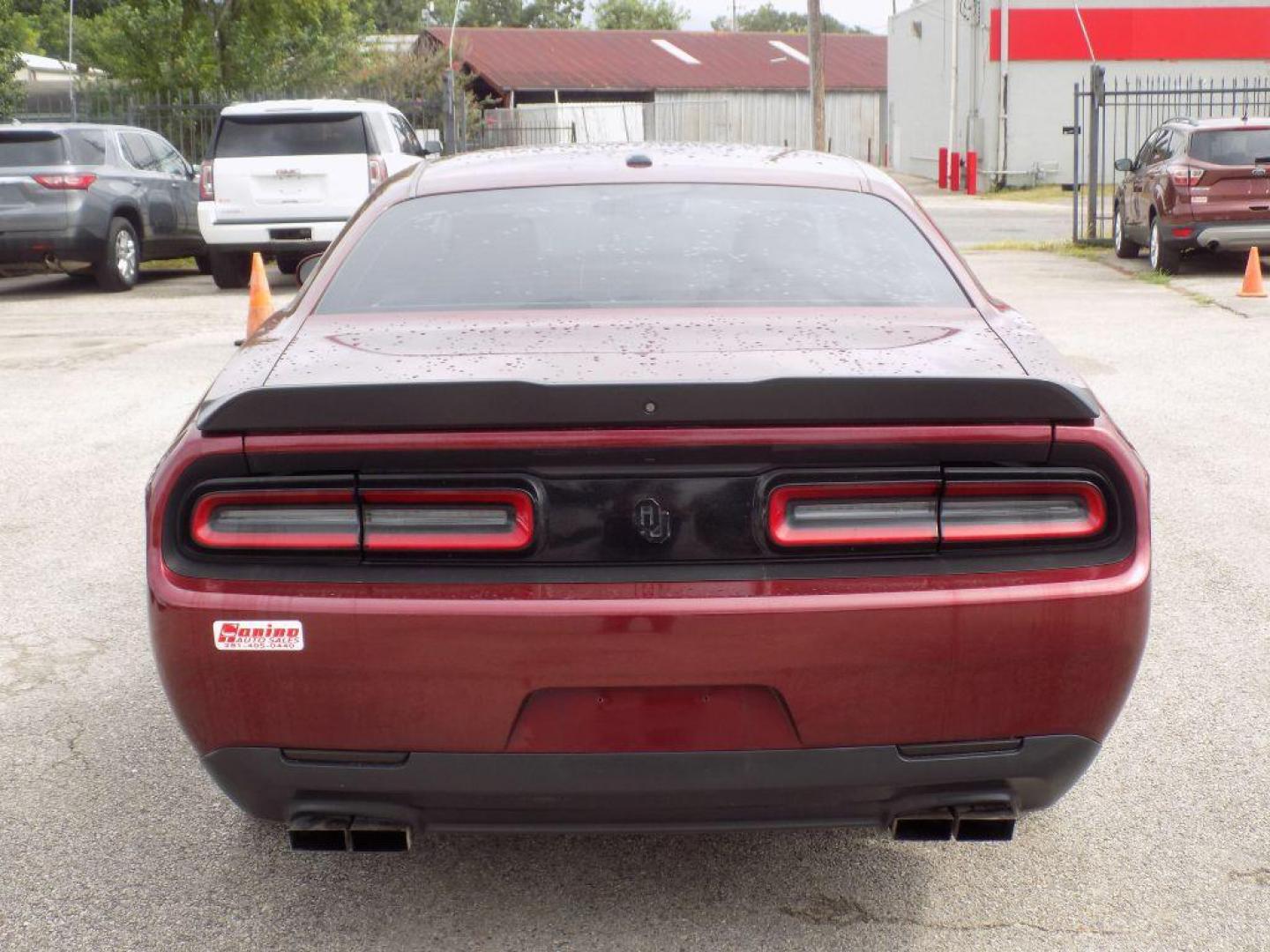 2021 MAROON DODGE CHALLENGER SXT (2C3CDZAG0MH) with an 3.6L engine, Automatic transmission, located at 830 E. Canino Rd., Houston, TX, 77037, (281) 405-0440, 38.358219, -81.729942 - Photo#3