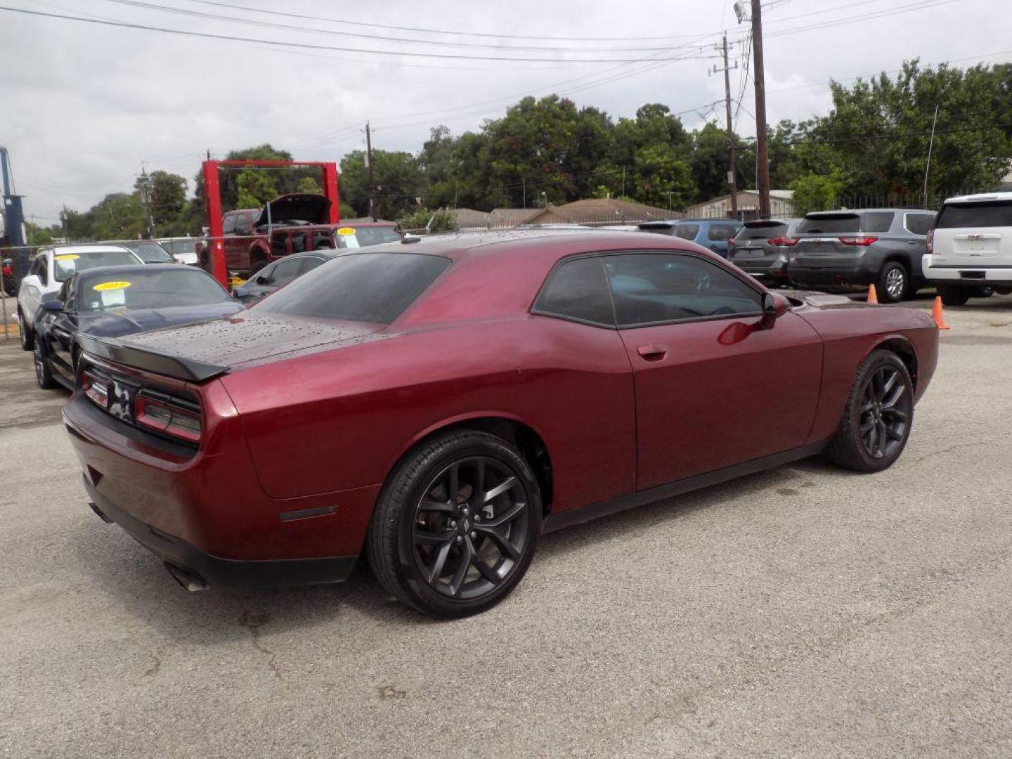 2021 MAROON DODGE CHALLENGER SXT (2C3CDZAG0MH) with an 3.6L engine, Automatic transmission, located at 830 E. Canino Rd., Houston, TX, 77037, (281) 405-0440, 38.358219, -81.729942 - Photo#4
