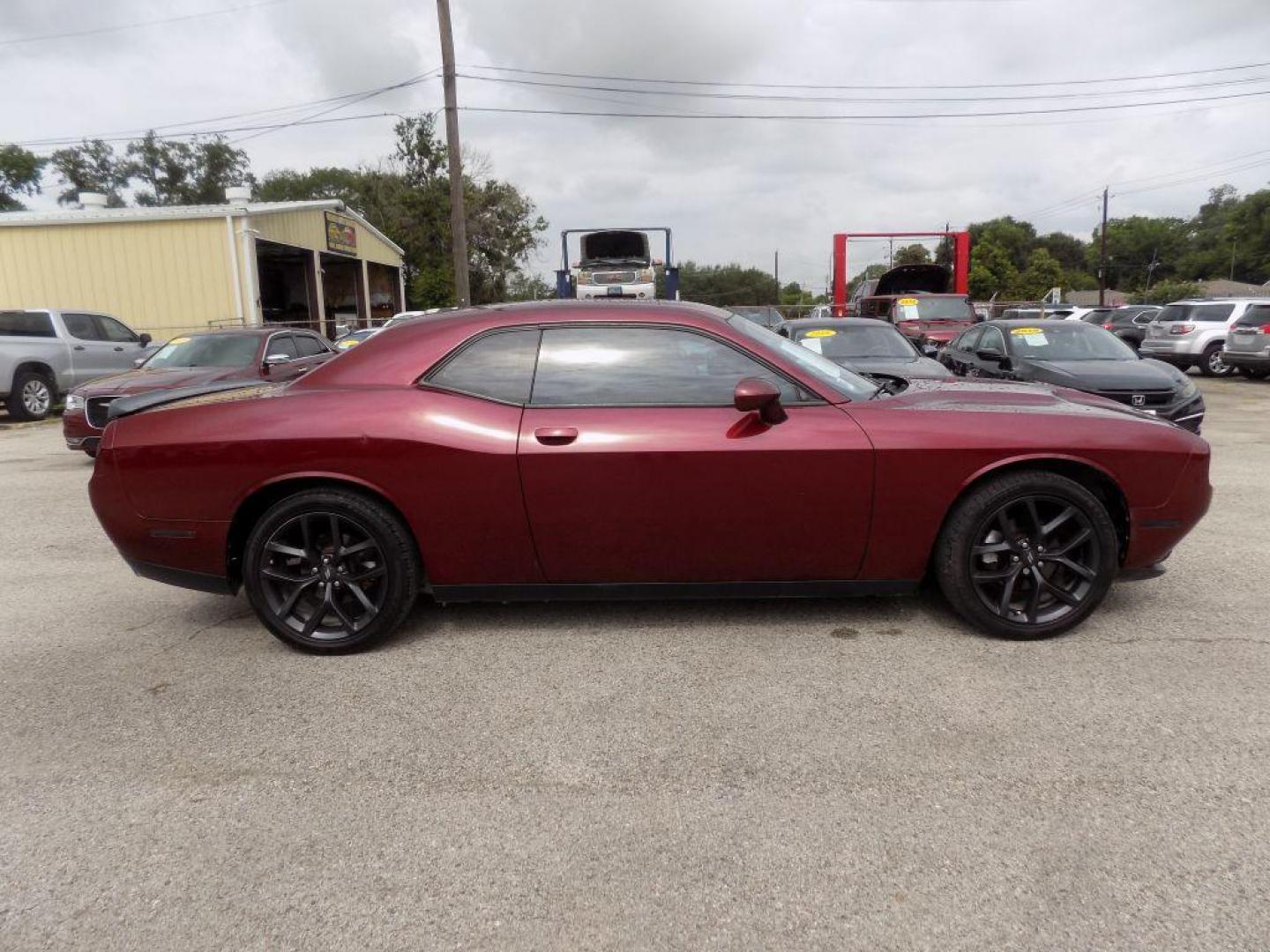 2021 MAROON DODGE CHALLENGER SXT (2C3CDZAG0MH) with an 3.6L engine, Automatic transmission, located at 830 E. Canino Rd., Houston, TX, 77037, (281) 405-0440, 38.358219, -81.729942 - Photo#5