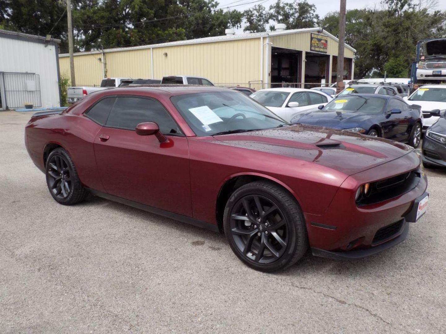 2021 MAROON DODGE CHALLENGER SXT (2C3CDZAG0MH) with an 3.6L engine, Automatic transmission, located at 830 E. Canino Rd., Houston, TX, 77037, (281) 405-0440, 38.358219, -81.729942 - Photo#6