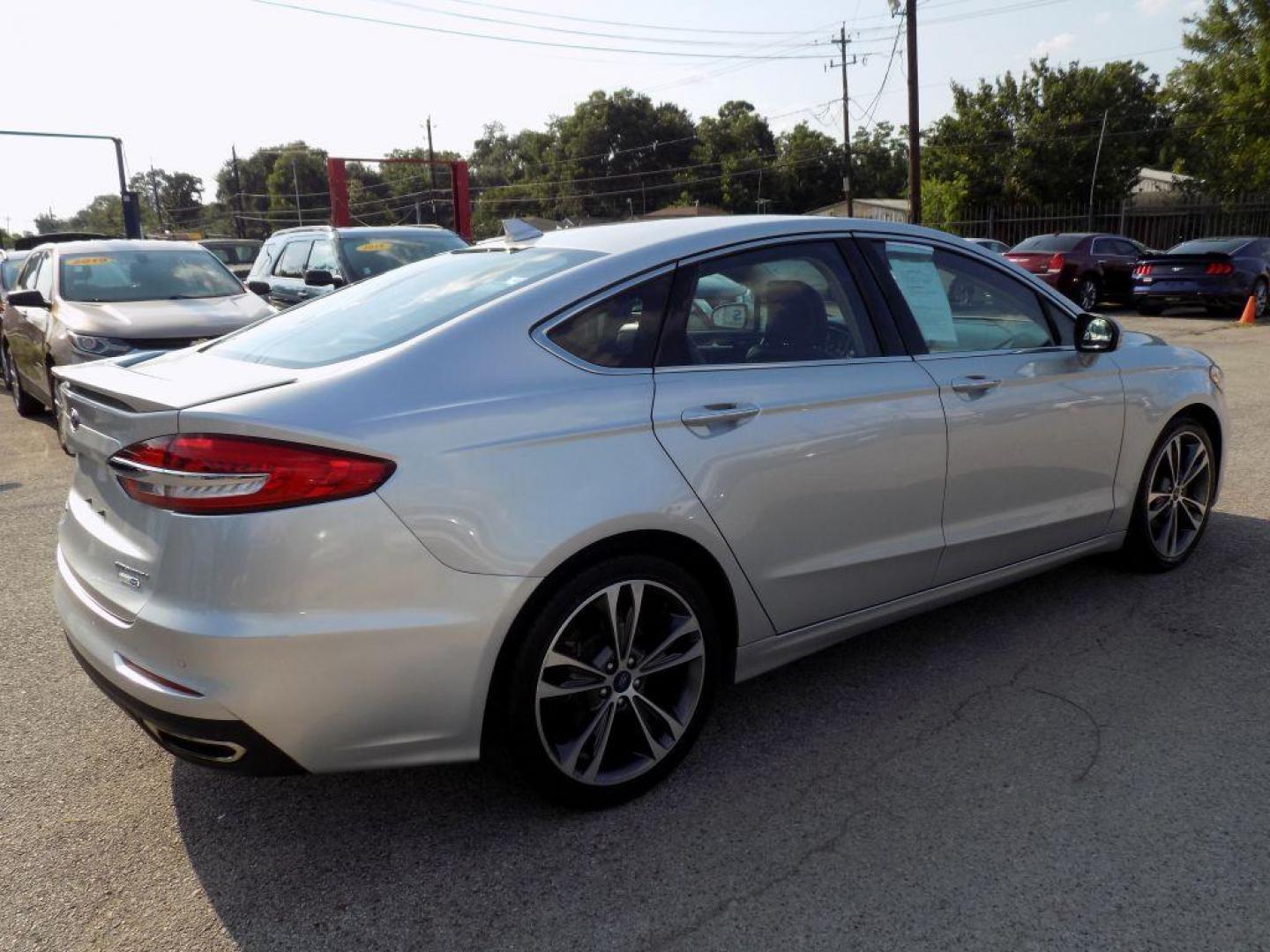 2019 SILVER FORD FUSION TITANIUM (3FA6P0D93KR) with an 2.0L engine, Automatic transmission, located at 830 E. Canino Rd., Houston, TX, 77037, (281) 405-0440, 38.358219, -81.729942 - Photo#5