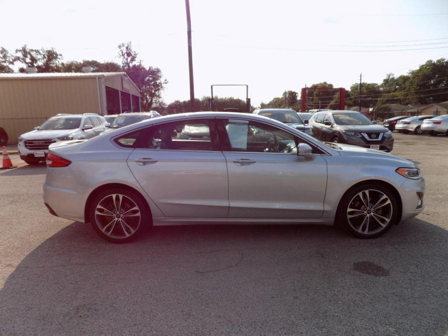 2019 SILVER FORD FUSION TITANIUM (3FA6P0D93KR) with an 2.0L engine, Automatic transmission, located at 830 E. Canino Rd., Houston, TX, 77037, (281) 405-0440, 38.358219, -81.729942 - Photo#6
