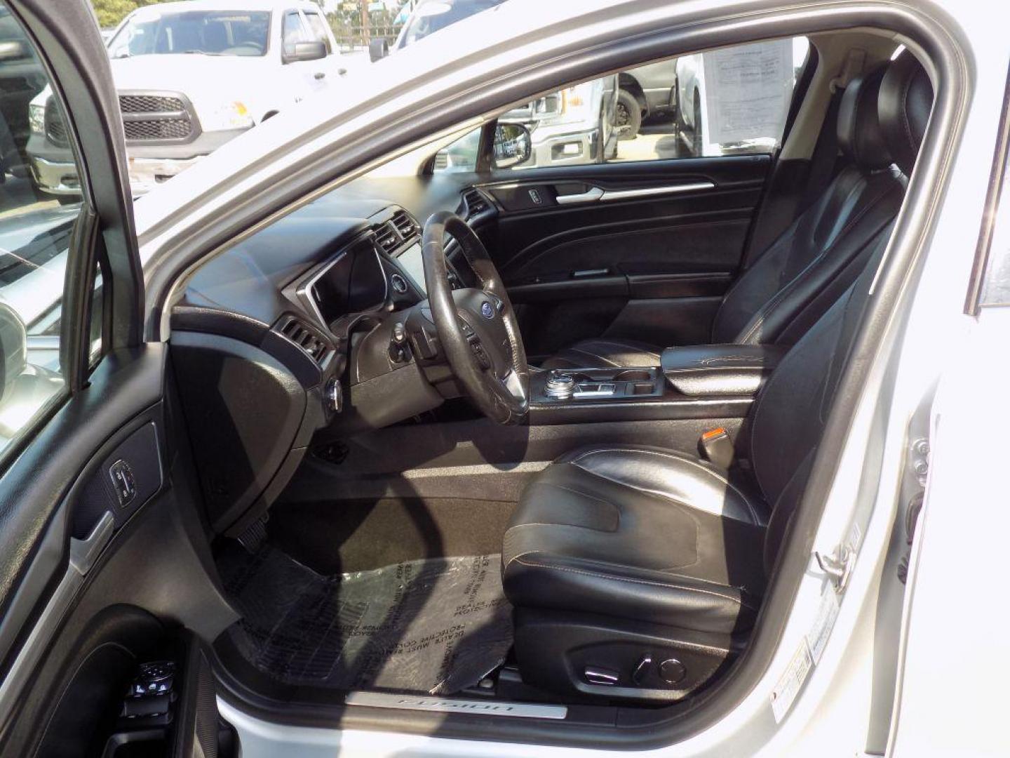 2019 SILVER FORD FUSION TITANIUM (3FA6P0D93KR) with an 2.0L engine, Automatic transmission, located at 830 E. Canino Rd., Houston, TX, 77037, (281) 405-0440, 38.358219, -81.729942 - Photo#12