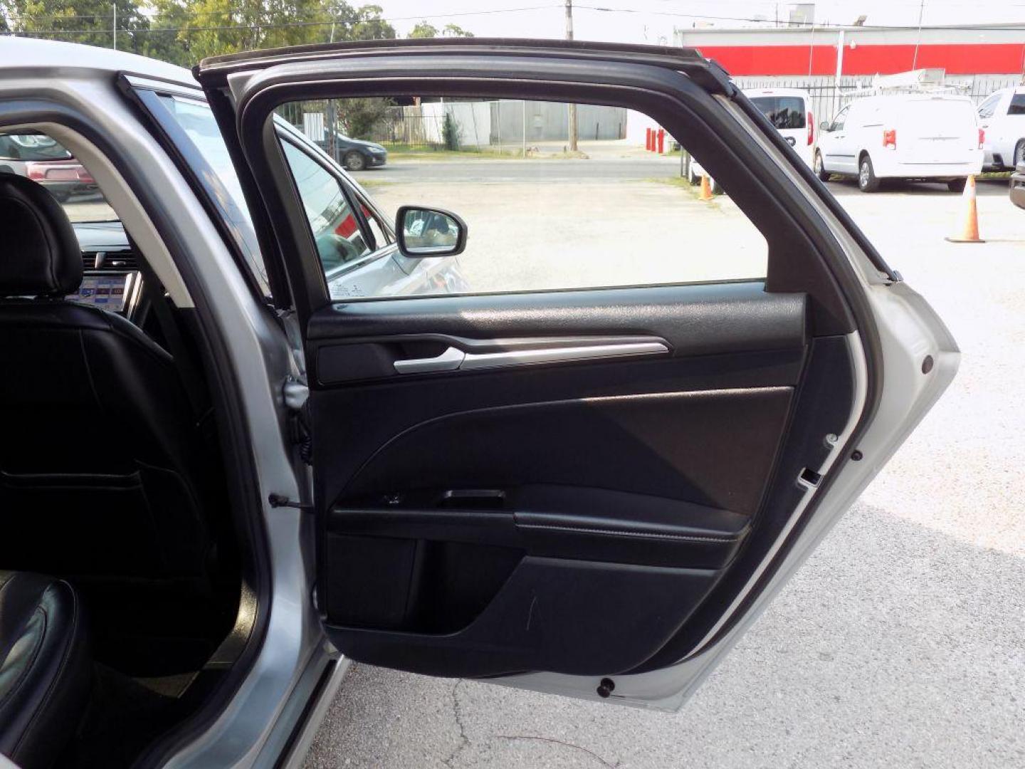 2019 SILVER FORD FUSION TITANIUM (3FA6P0D93KR) with an 2.0L engine, Automatic transmission, located at 830 E. Canino Rd., Houston, TX, 77037, (281) 405-0440, 38.358219, -81.729942 - Photo#15