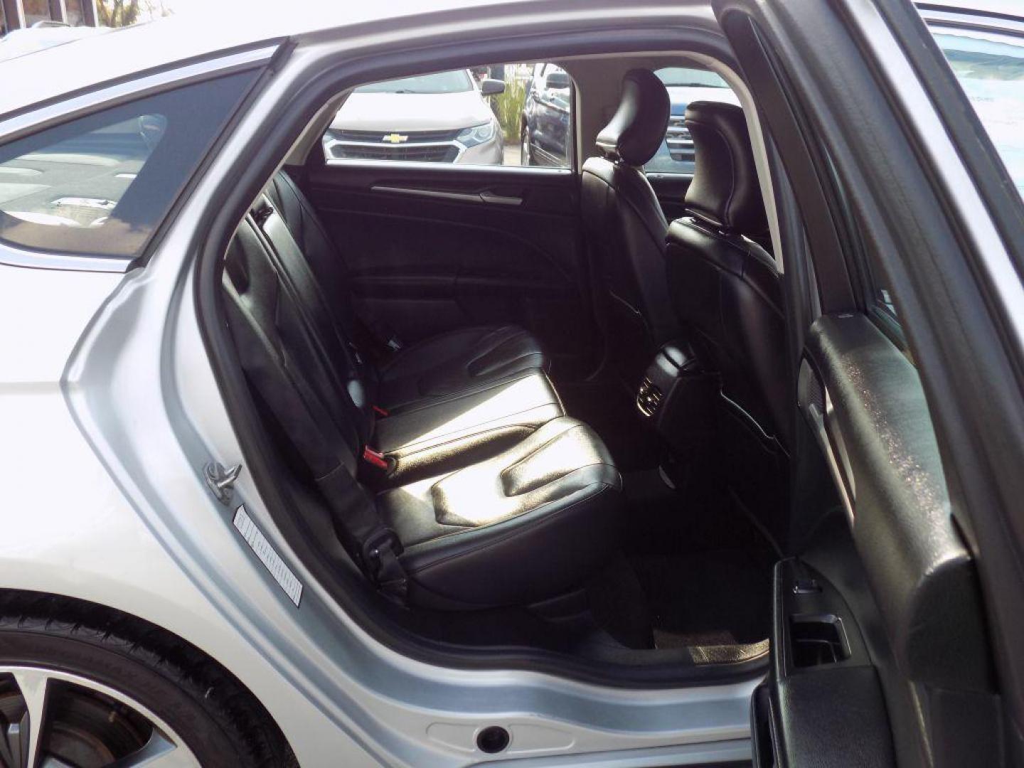 2019 SILVER FORD FUSION TITANIUM (3FA6P0D93KR) with an 2.0L engine, Automatic transmission, located at 830 E. Canino Rd., Houston, TX, 77037, (281) 405-0440, 38.358219, -81.729942 - Photo#16