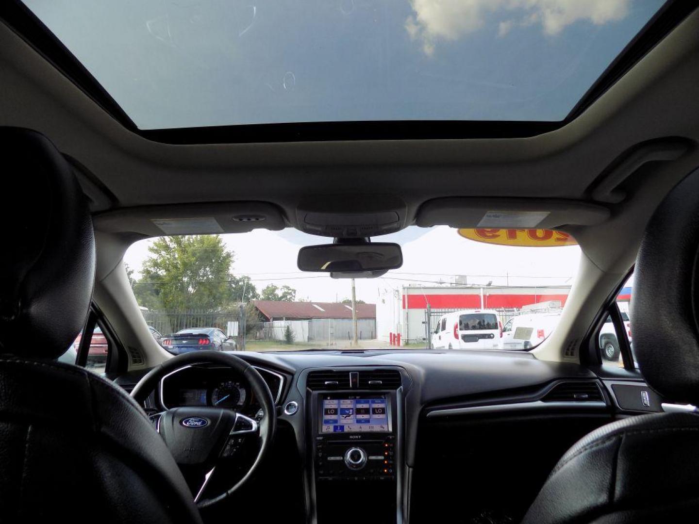 2019 SILVER FORD FUSION TITANIUM (3FA6P0D93KR) with an 2.0L engine, Automatic transmission, located at 830 E. Canino Rd., Houston, TX, 77037, (281) 405-0440, 38.358219, -81.729942 - Photo#21