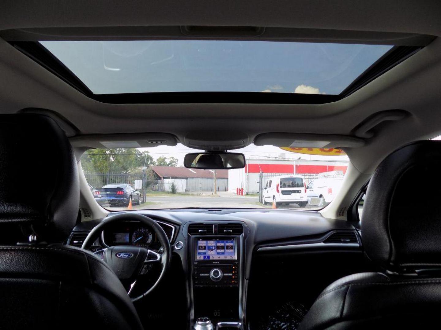 2019 SILVER FORD FUSION TITANIUM (3FA6P0D93KR) with an 2.0L engine, Automatic transmission, located at 830 E. Canino Rd., Houston, TX, 77037, (281) 405-0440, 38.358219, -81.729942 - Photo#22