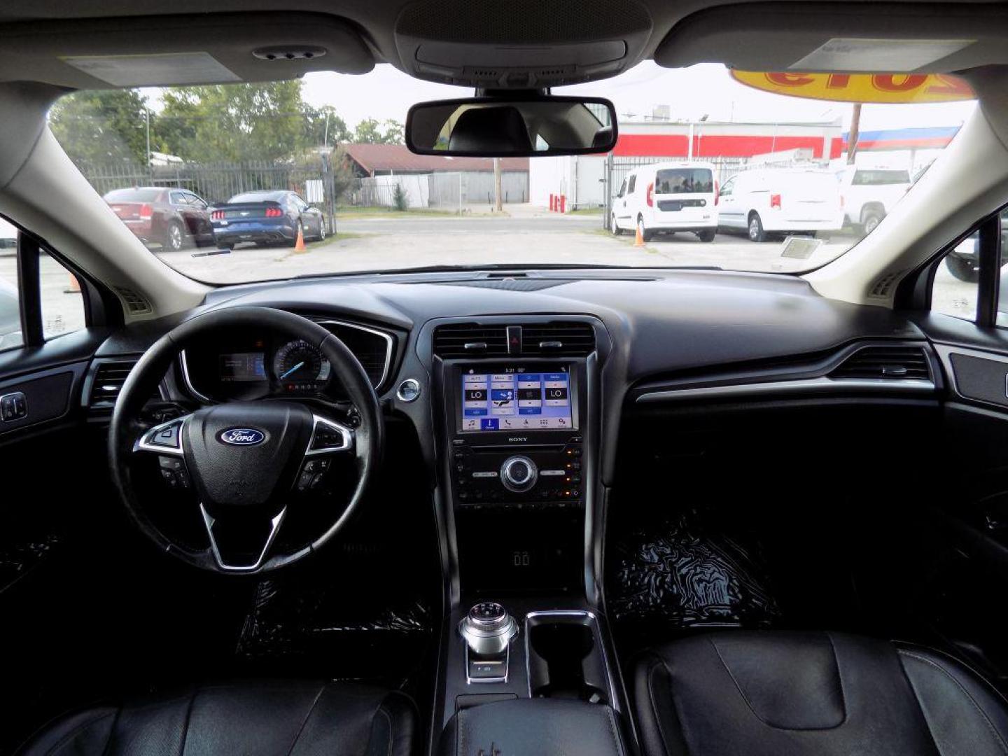 2019 SILVER FORD FUSION TITANIUM (3FA6P0D93KR) with an 2.0L engine, Automatic transmission, located at 830 E. Canino Rd., Houston, TX, 77037, (281) 405-0440, 38.358219, -81.729942 - Photo#23