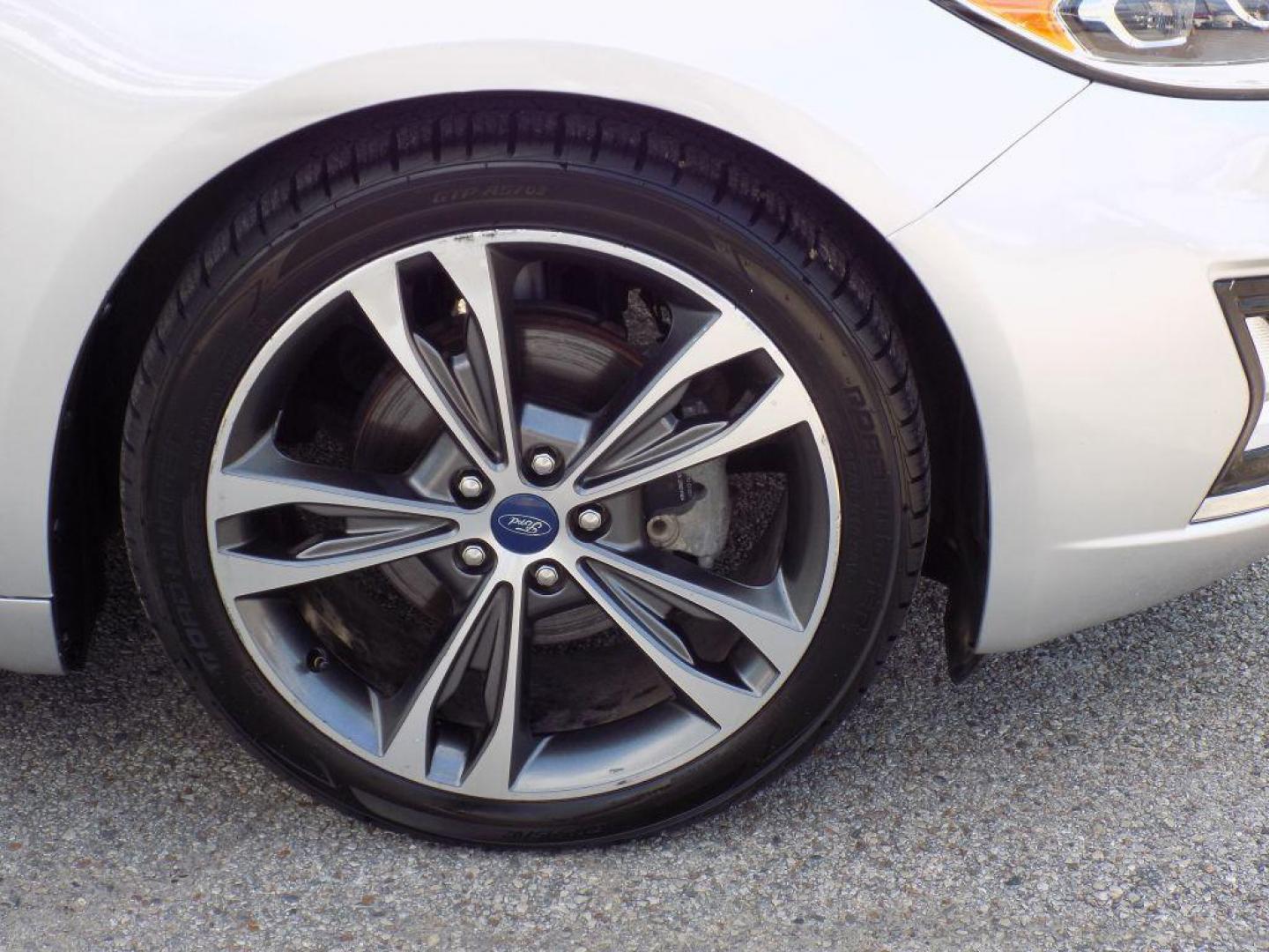 2019 SILVER FORD FUSION TITANIUM (3FA6P0D93KR) with an 2.0L engine, Automatic transmission, located at 830 E. Canino Rd., Houston, TX, 77037, (281) 405-0440, 38.358219, -81.729942 - Photo#26