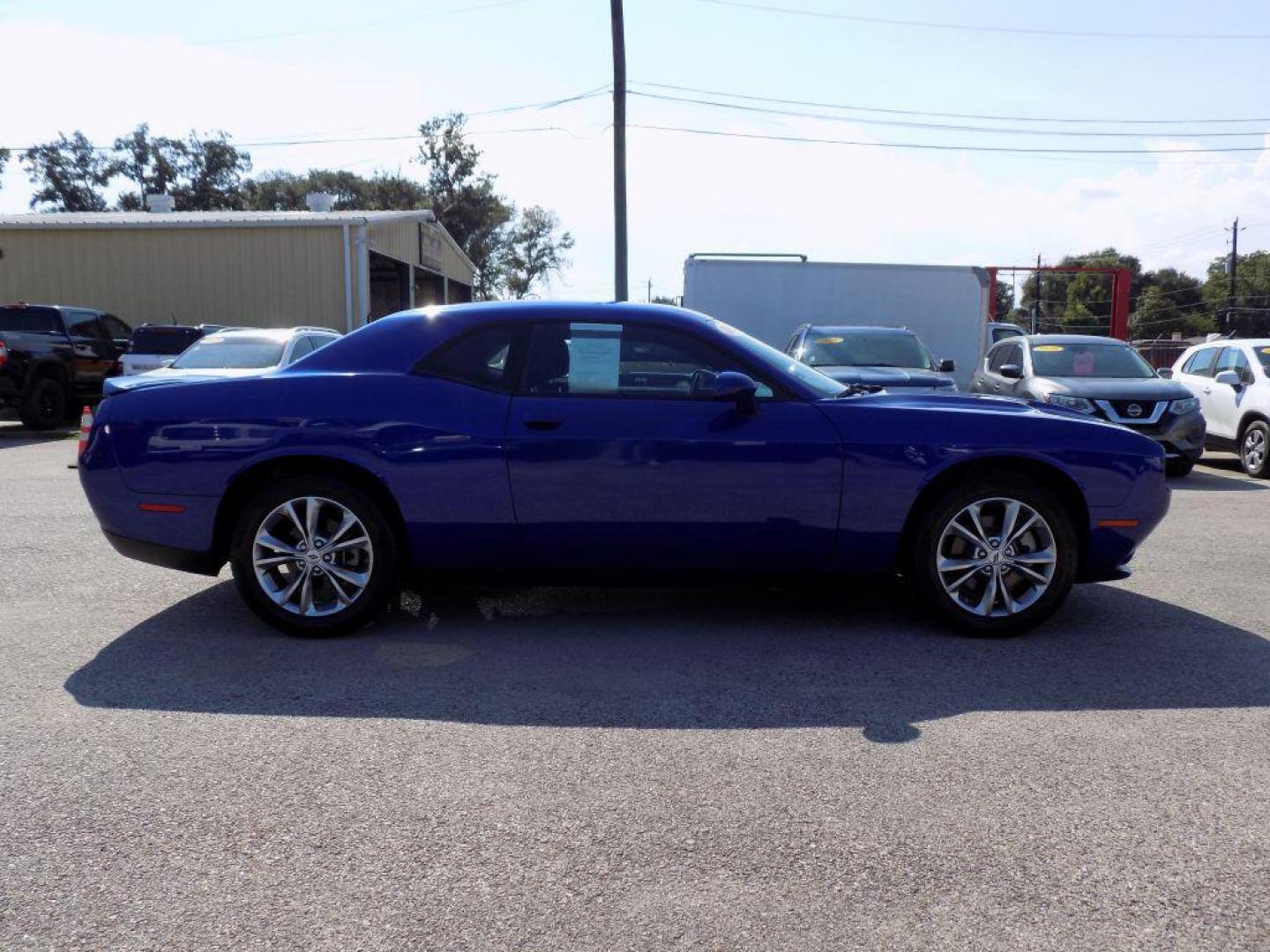2022 BLUE DODGE CHALLENGER SXT (2C3CDZGG9NH) with an 3.6L engine, Automatic transmission, located at 830 E. Canino Rd., Houston, TX, 77037, (281) 405-0440, 38.358219, -81.729942 - Photo#6